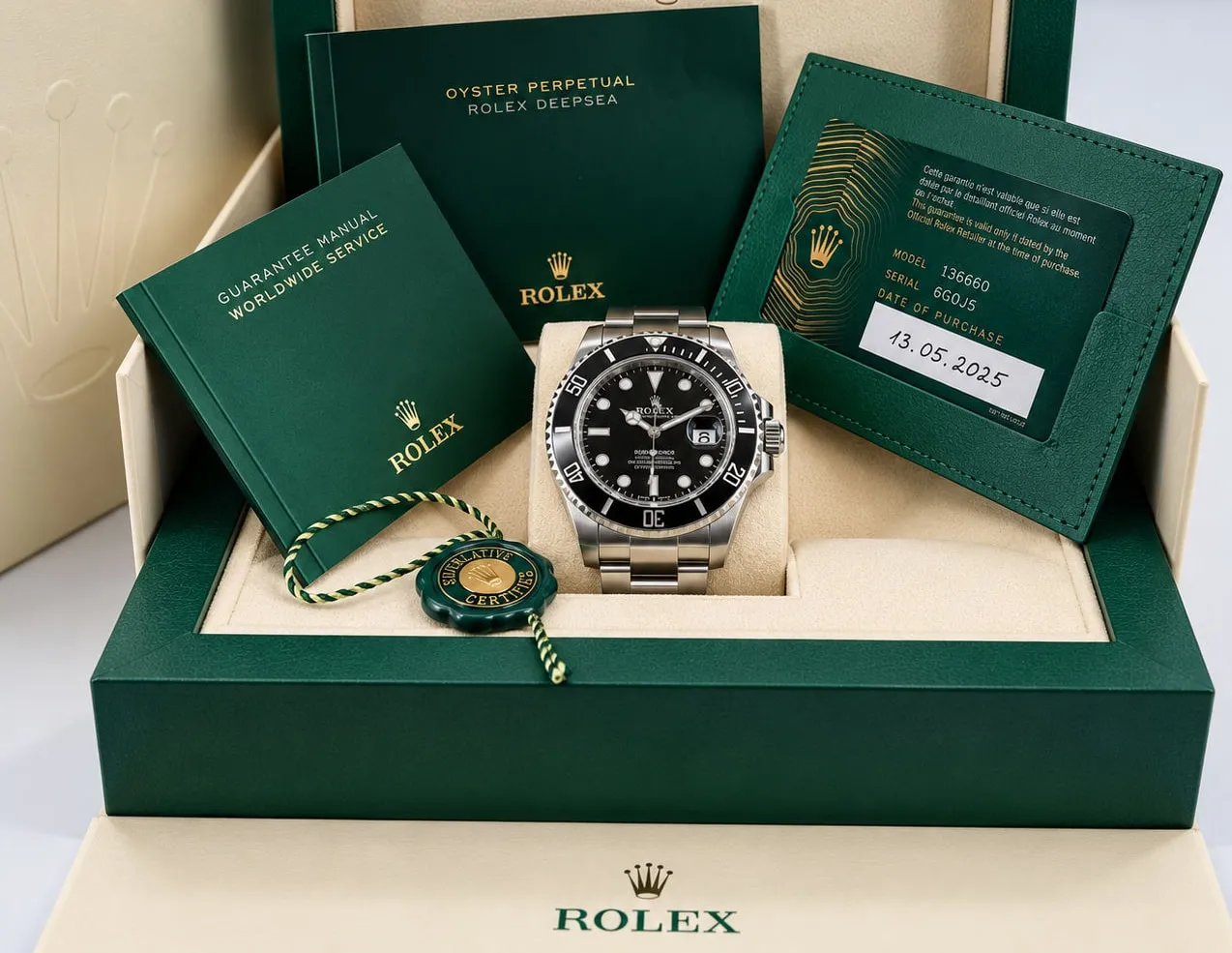 Rolex Submariner in grüner Originalbox mit Garantiekarte und Booklets